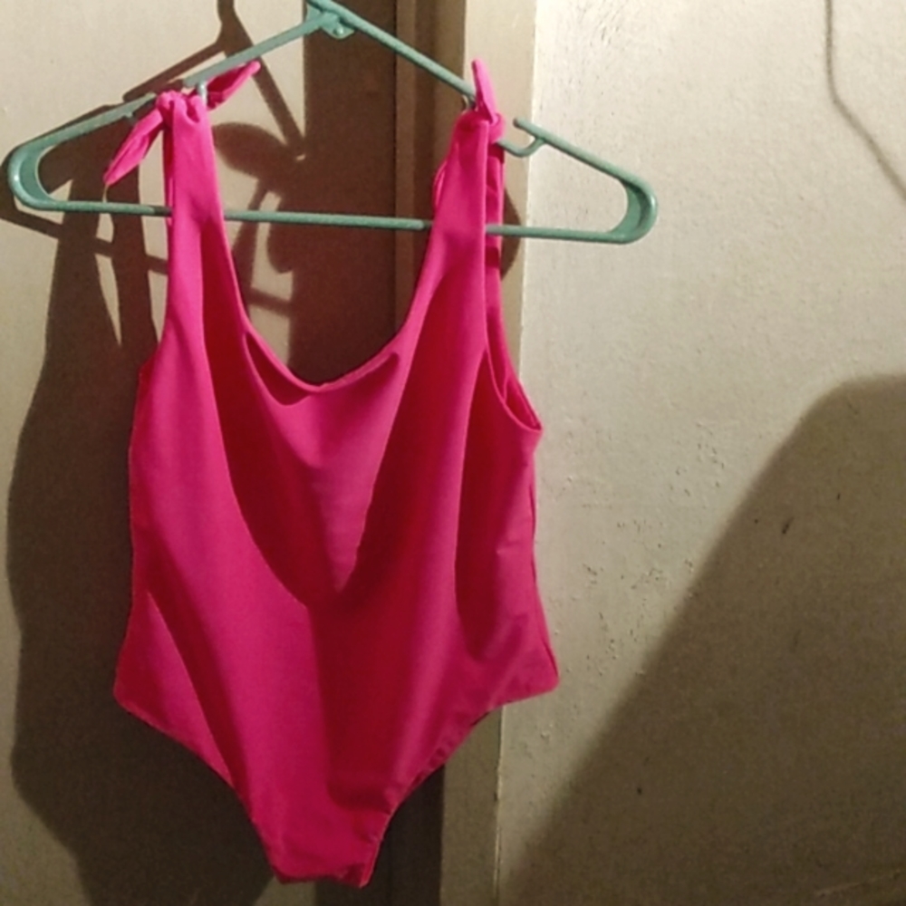 This is a bright swim suit one piece and it's pink